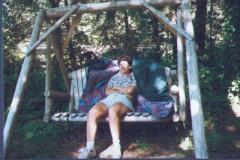 Donna-Relaxing-on-the-Swing-at-the-Cabin